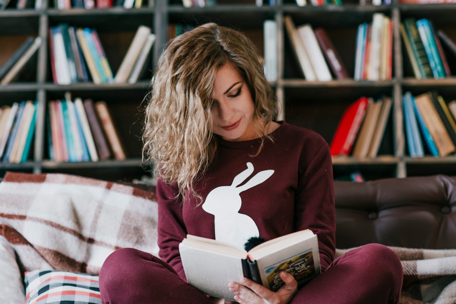 charming-woman-reading-sofa